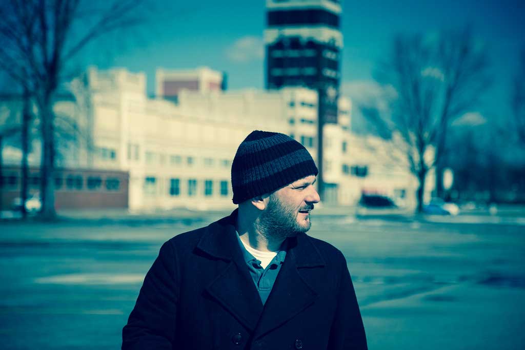 Dennis Reed Jr standing in front of the iconic Wurlitzer Building in North Tonawanda, N.Y.